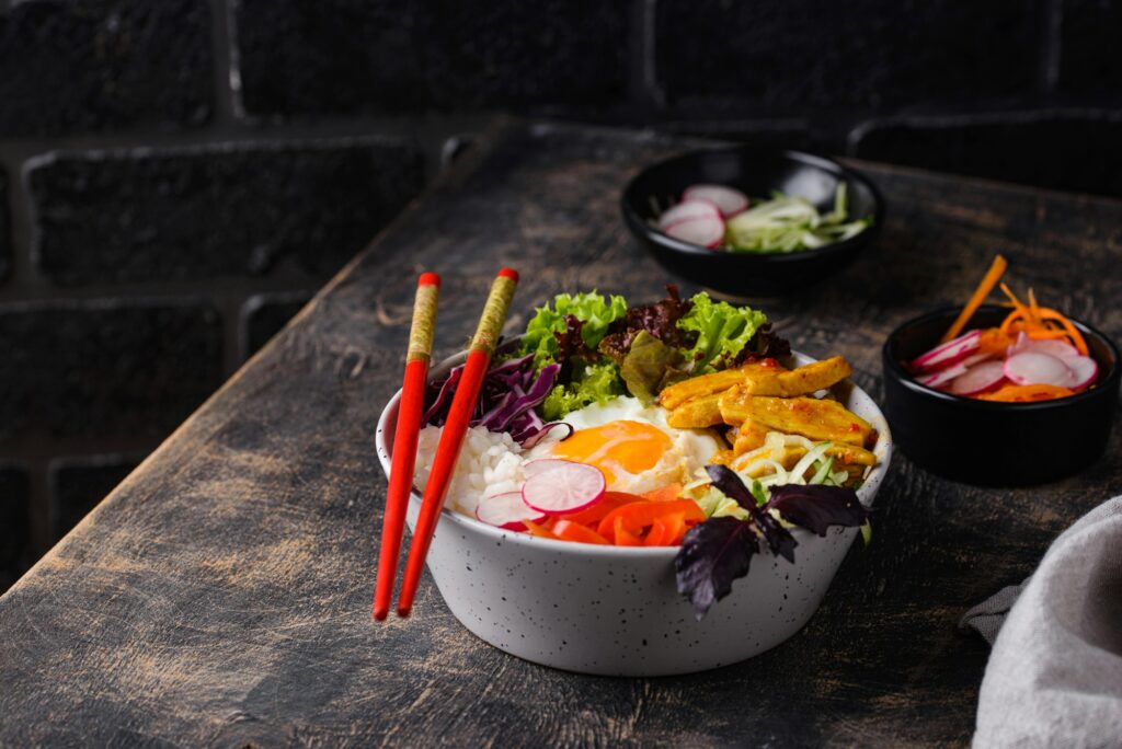 Korean Bibimbap. Bowl with meat, rice and salad